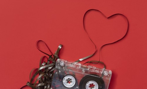 Analog audio cassette on red background
