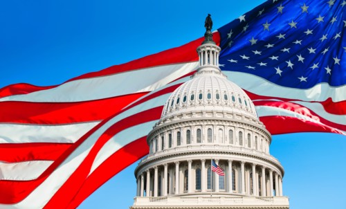 USA, Washington D.C., Capitol Building against background of American flag