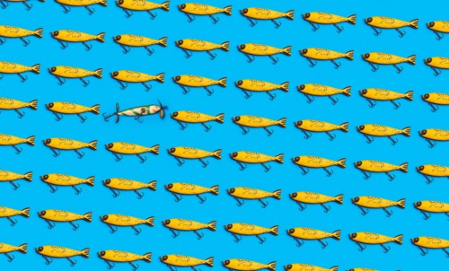 Vintage fishing lures on blue background