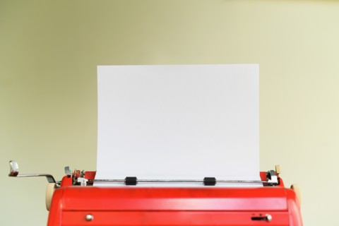 Typewriter with blank sheet of paper