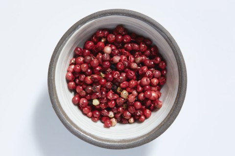 Red peppercorns in bowl