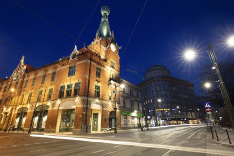 Poland, Lesser Poland, Krakow, Illuminated street and buildings in historic city district