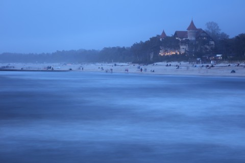 Poland, Pomerania, Leba, Castle at Baltic Sea coast at dusk