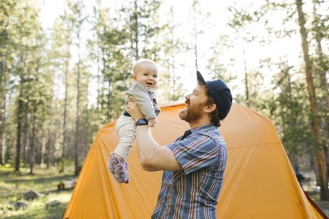 Father lifting baby boy