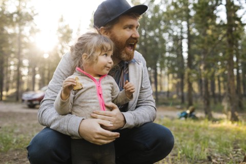 Smiling man with daughter