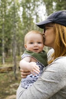 Woman kissing baby son