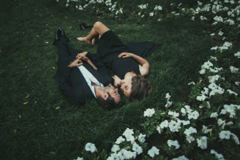 Ukraine, Couple lying down on grass