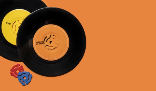 Vintage records on orange background