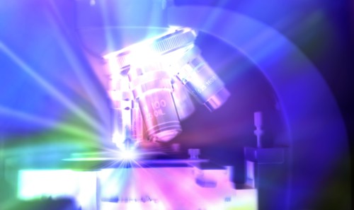 Close-up of microscope lens with abstract light