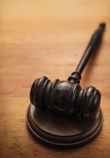 Gavel on wooden background