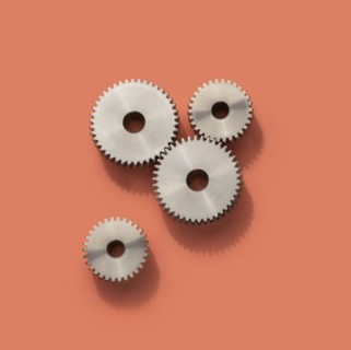 Cog wheels on pink background