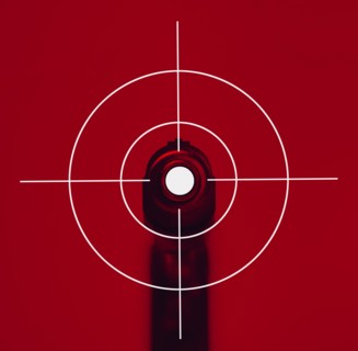 Shooting target on red background with gun
