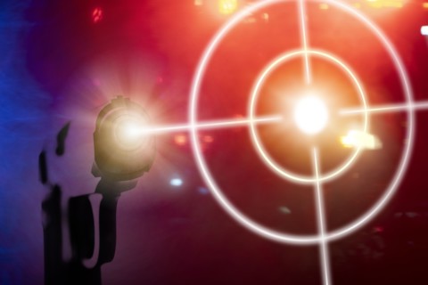Shooting target on red background with gun