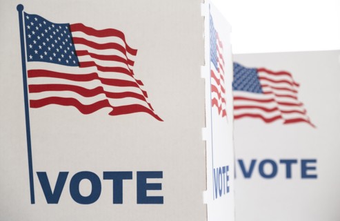 Voting booth with US flag