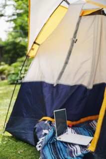 Tent and laptop in garden