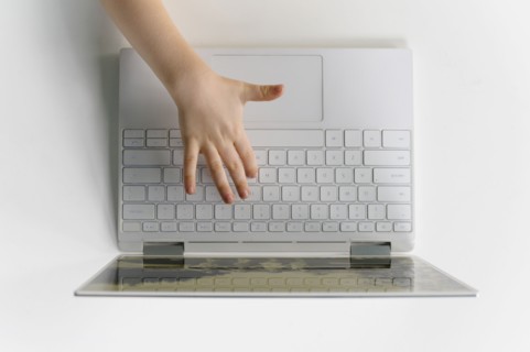 Boys (4-5) hand on laptop