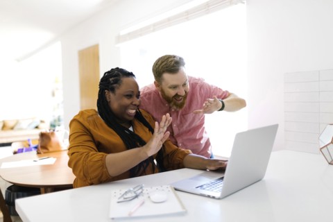 Man and woman during zoom call at home