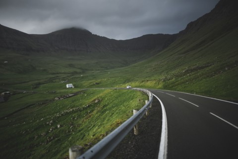 Denmark, Faroe Islands, Vagar, Sorvagur, Road through green landscape