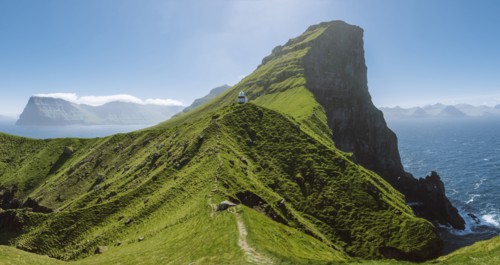 Denmark, Faroe Islands, Klaksvik, Trollanes, Kallur Lighthouse on sunny day