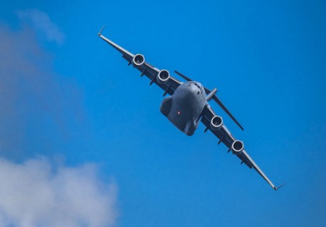 McDonnell Douglas/Boeing C-17 Globemaster III American Air Force cargo plane flying against sky