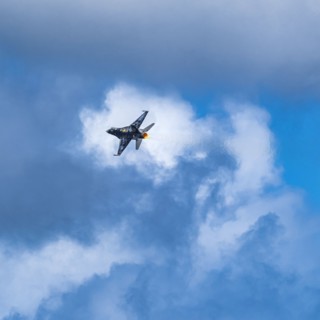 F-16 Fighting Falcon flying against sky