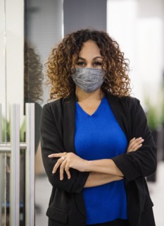 Portrait of businesswoman wearing face mask in office