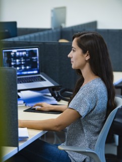 Woman working on computer in office