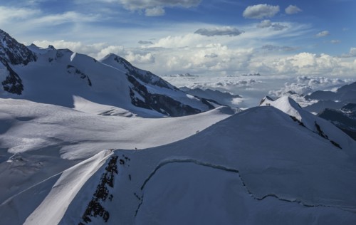 Climbers on mountain ridge at Monte Rosa Massif