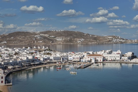 Fishing boats in harbor and white houses