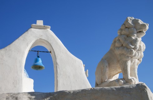 Bell tower and lion statue of Paraportiani Orthodox Church