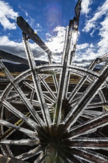 Frosted water wheel on ranch in morning sun