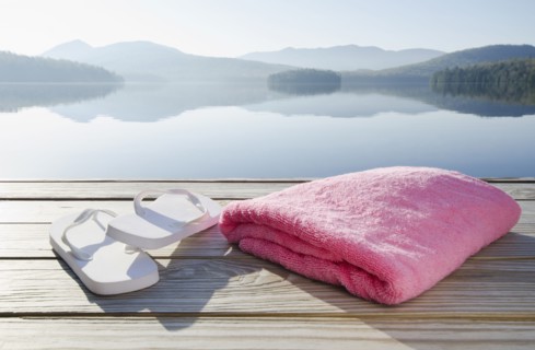 Sandals and towel on dock
