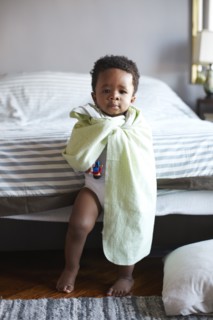 African American boy wrapped in blanket