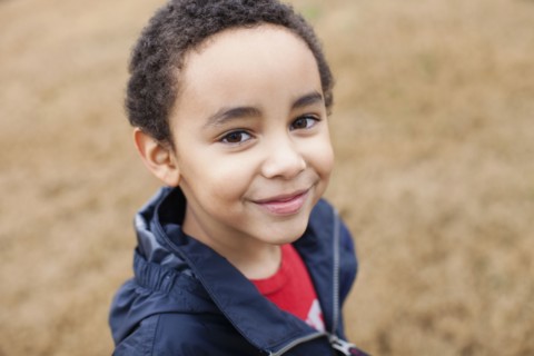 Mixed race boy smiling