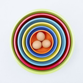Eggs in colorful nesting bowls
