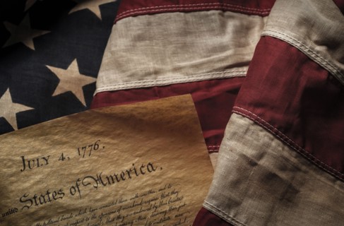 Close-up of Declaration of Independence resting on American flag