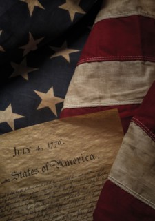Close-up of Declaration of Independence resting on American flag