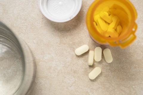 Overhead view of pills in prescription bottle