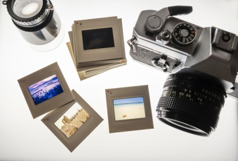 Studio shot of analog camera and slides