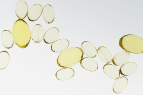 Fish oil pills on white background