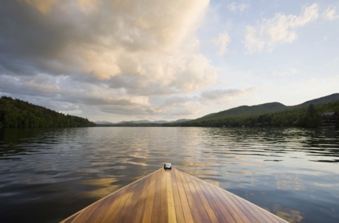 Wooden boat on Lake Placid at sunset