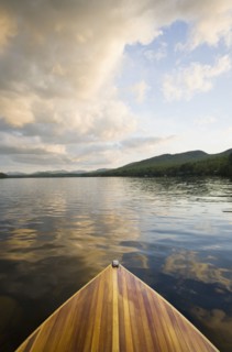 Wooden boat on Lake Placid at sunset