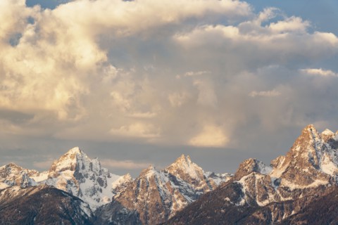 Snow covered Teton mountains at sunrise