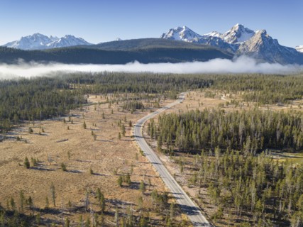 Landscape with forests and Sawtooth Mountains in snow