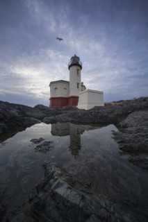 Coquille River Lighthouse reflecting in water