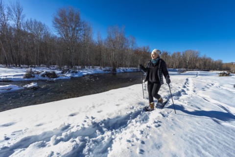 Senior woman snowshoeing