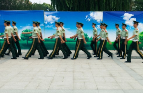 Policemen walking in Tiananman Square