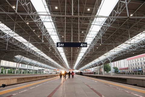People on Beijing train station platform