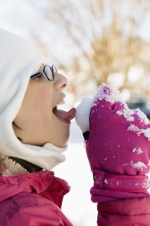 Girl licking snow
