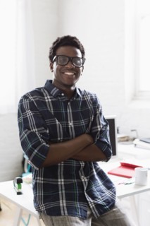 Portrait of young man wearing checked shirt